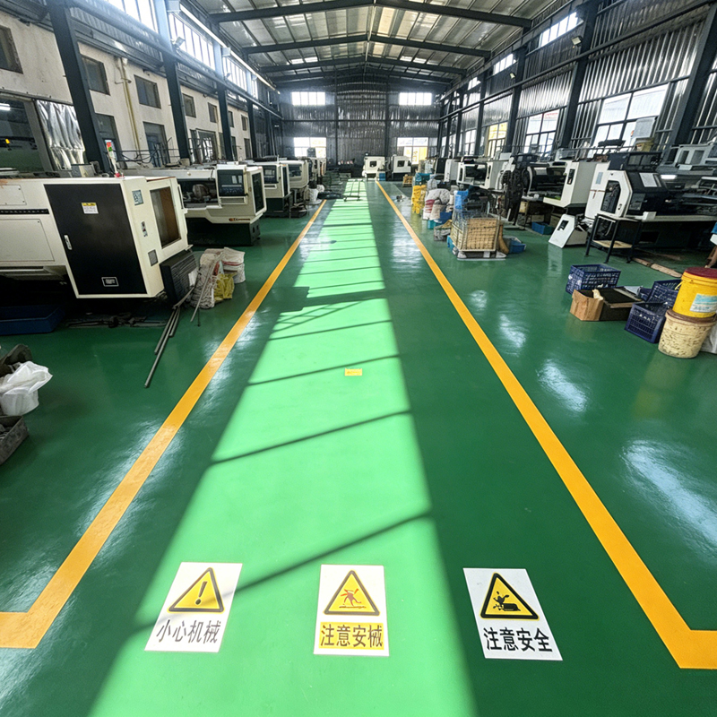 Automated CNC machining equipment inside the factory floor