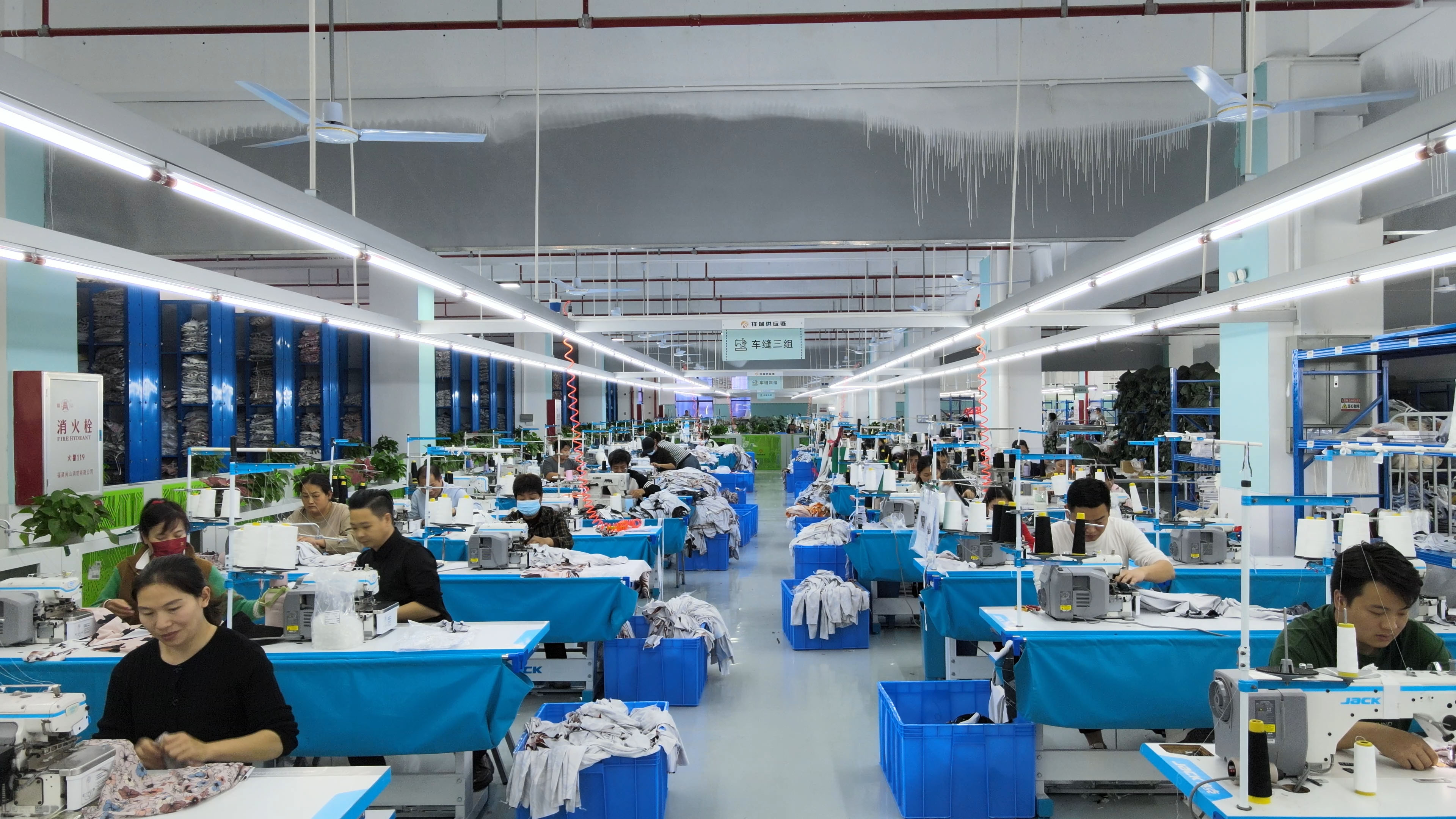 Industrial fabric cutting and garment preparation facility