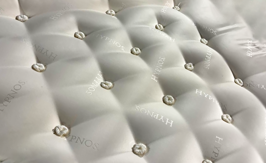 Detail view of the tufting needles and compression plate on the YT-CD-3A Advanced Mattress Tufting Machine
