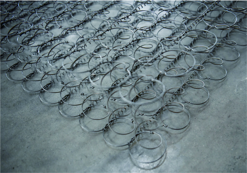 Automated spring coiling and grid assembly mechanism of the YT-CW-2 system