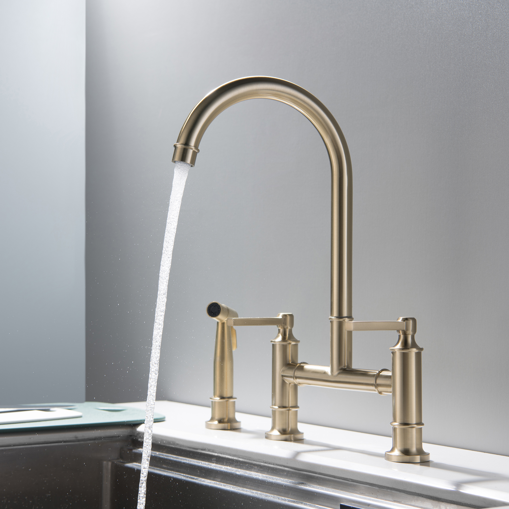 Double Handle High-Arc Bridge Kitchen Faucet in Brushed Gold with Brass and 304 Stainless Steel construction