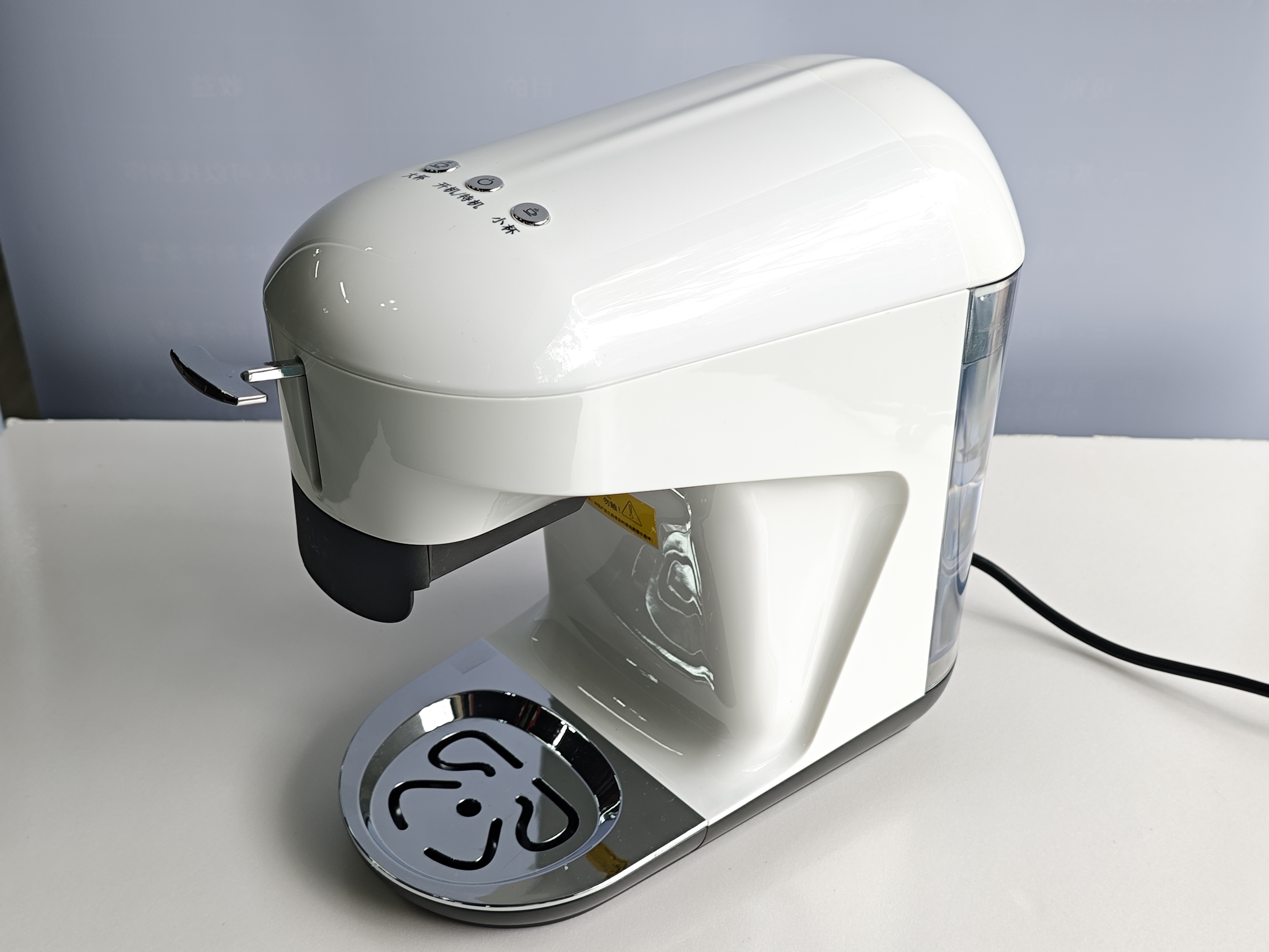 Compact commercial coffee machine side view showing water tank