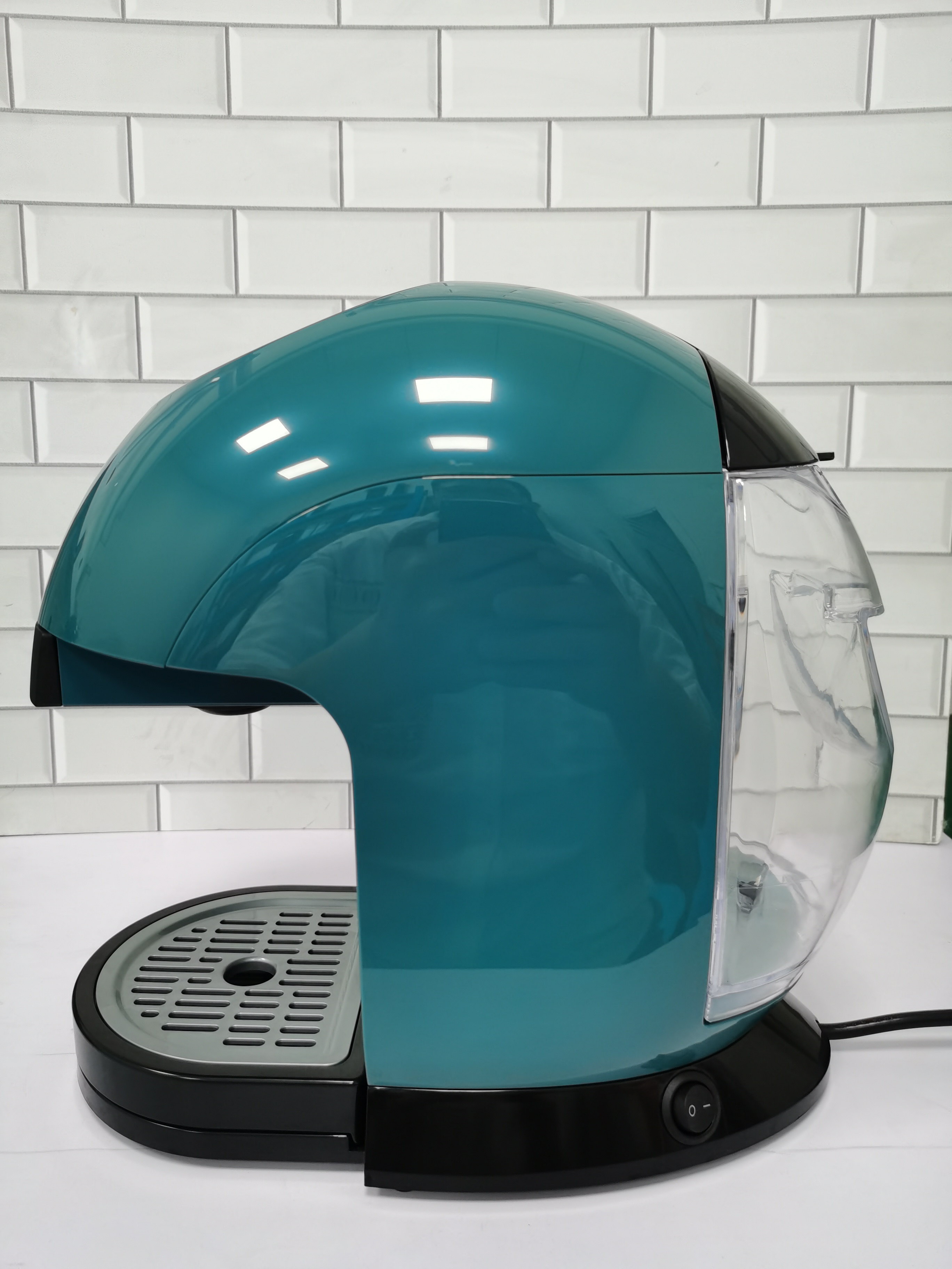 Compact commercial coffee machine showing removable water tank and tray design