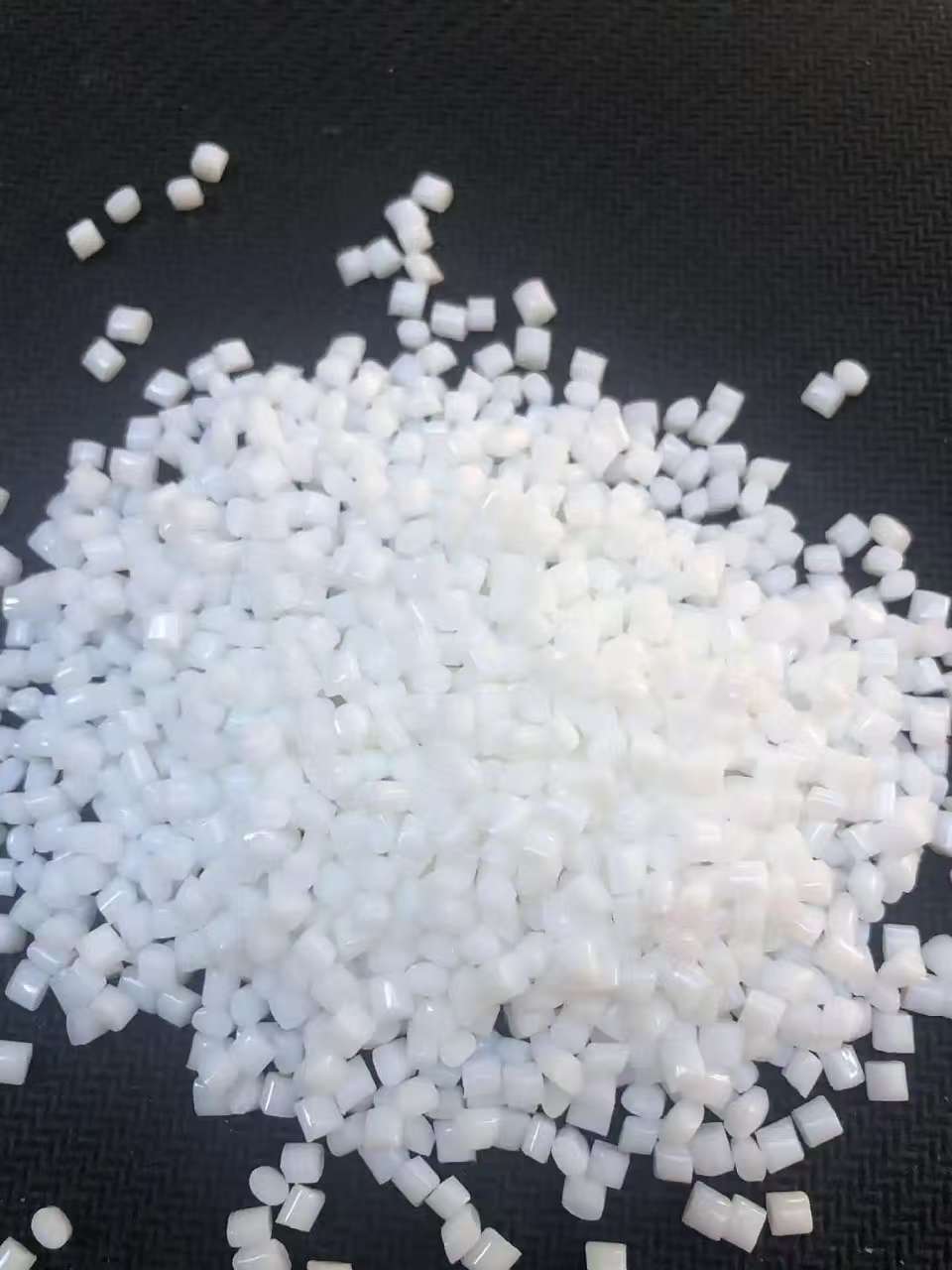 Granular plastic pellet batch packaged under strict quality inspection standards