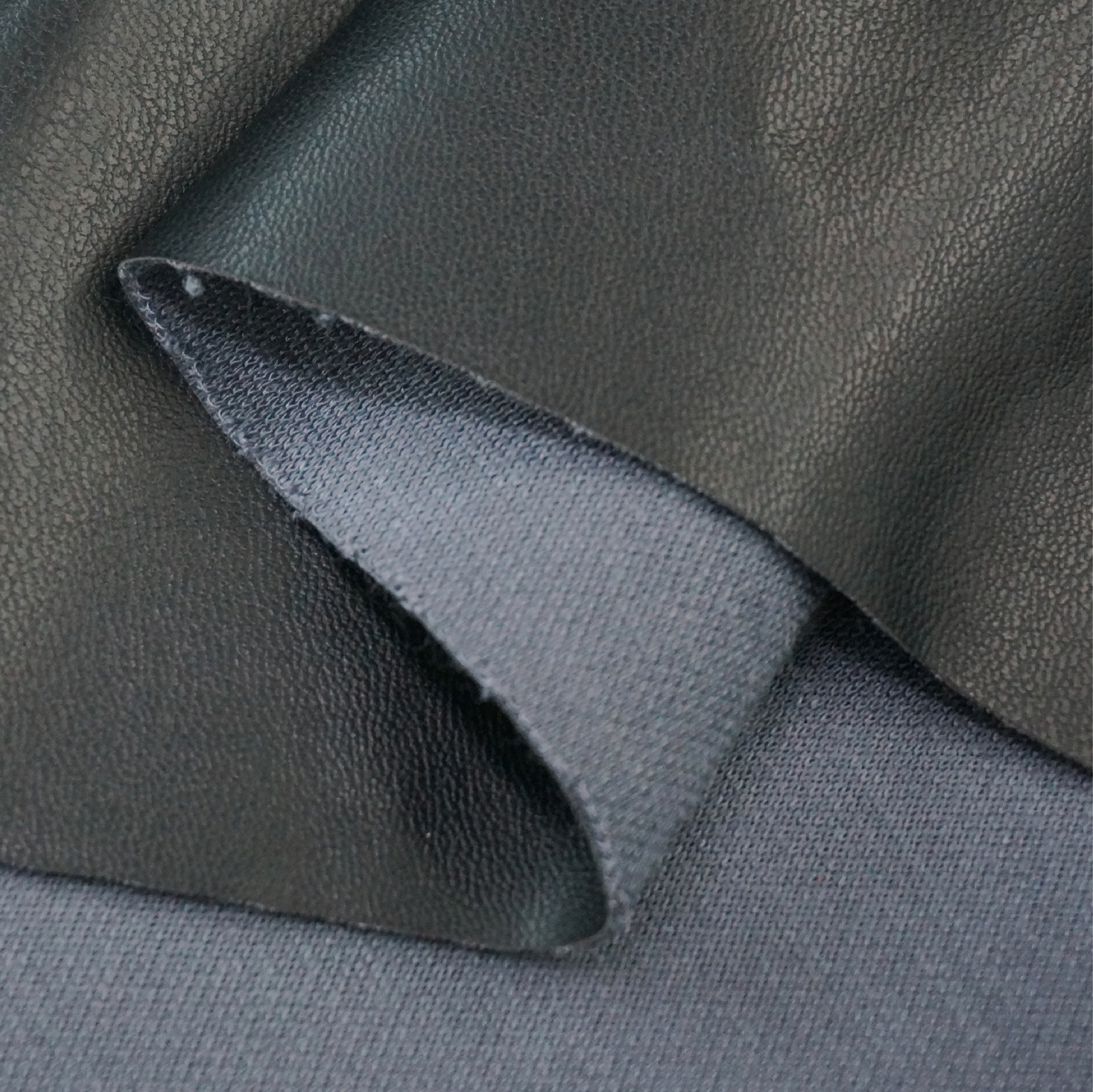 Custom color synthetic leather sample rolls showing texture and color consistency
