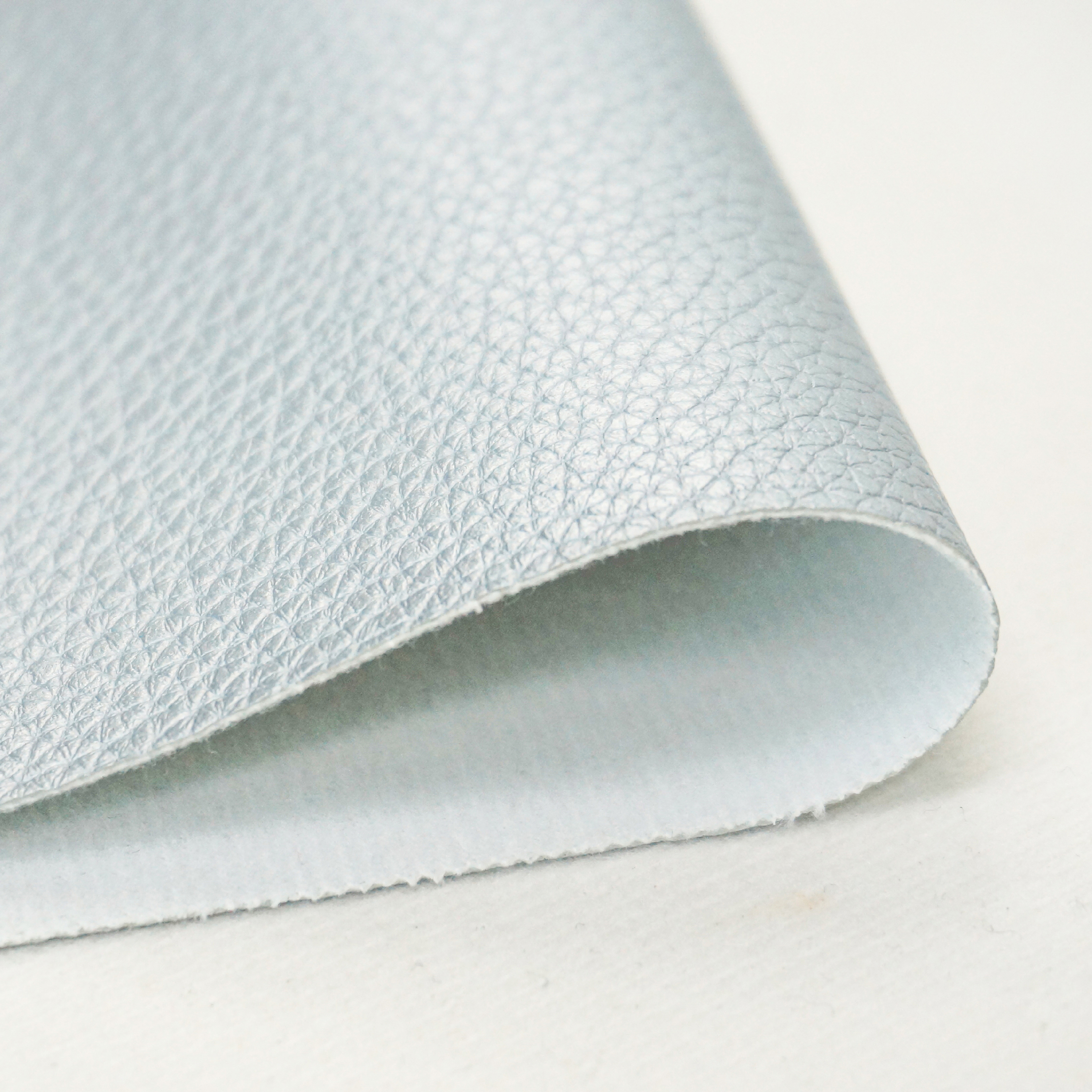Solvent-free PU upholstery leather material close-up showing natural texture