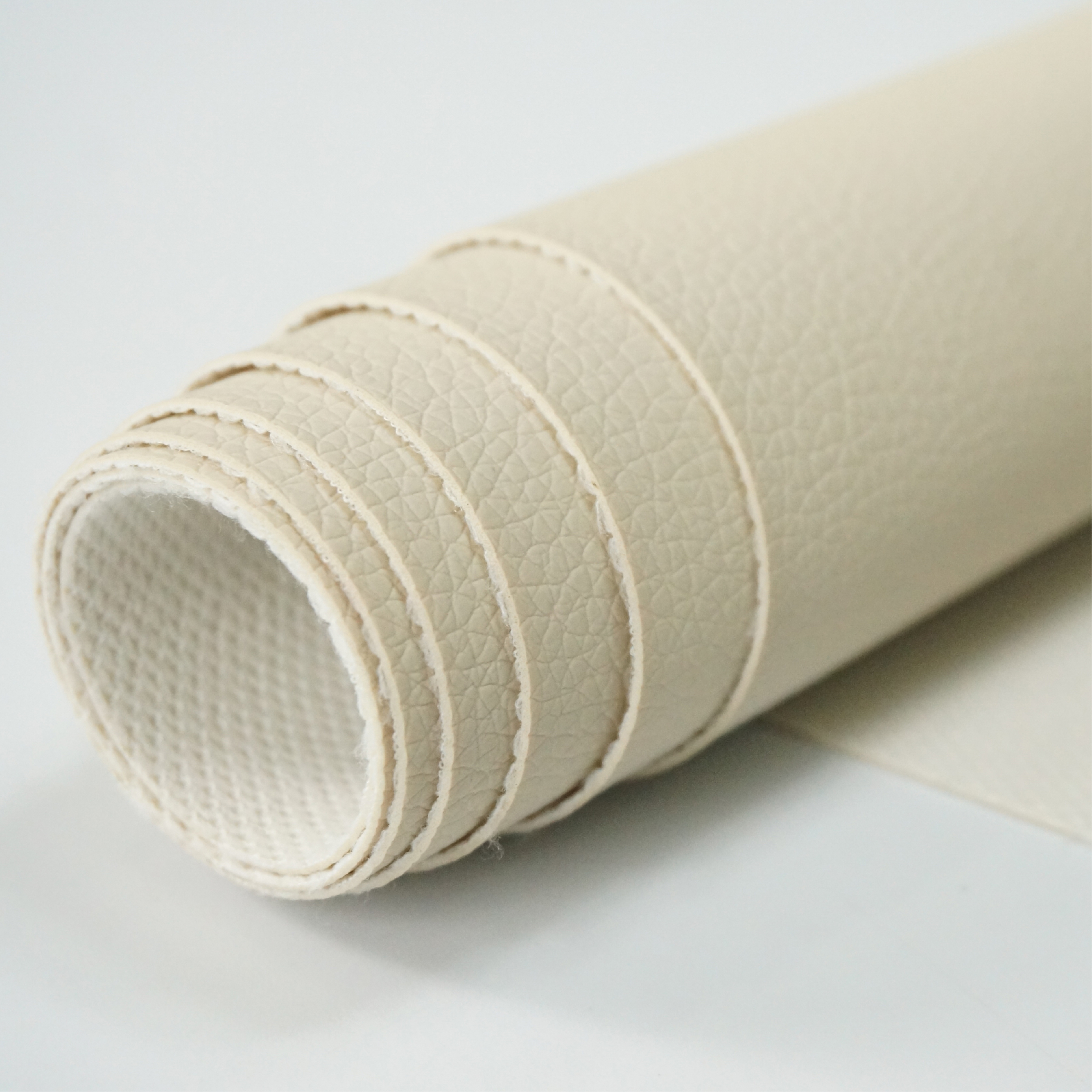 Customized synthetic leather surface for upholstery applications