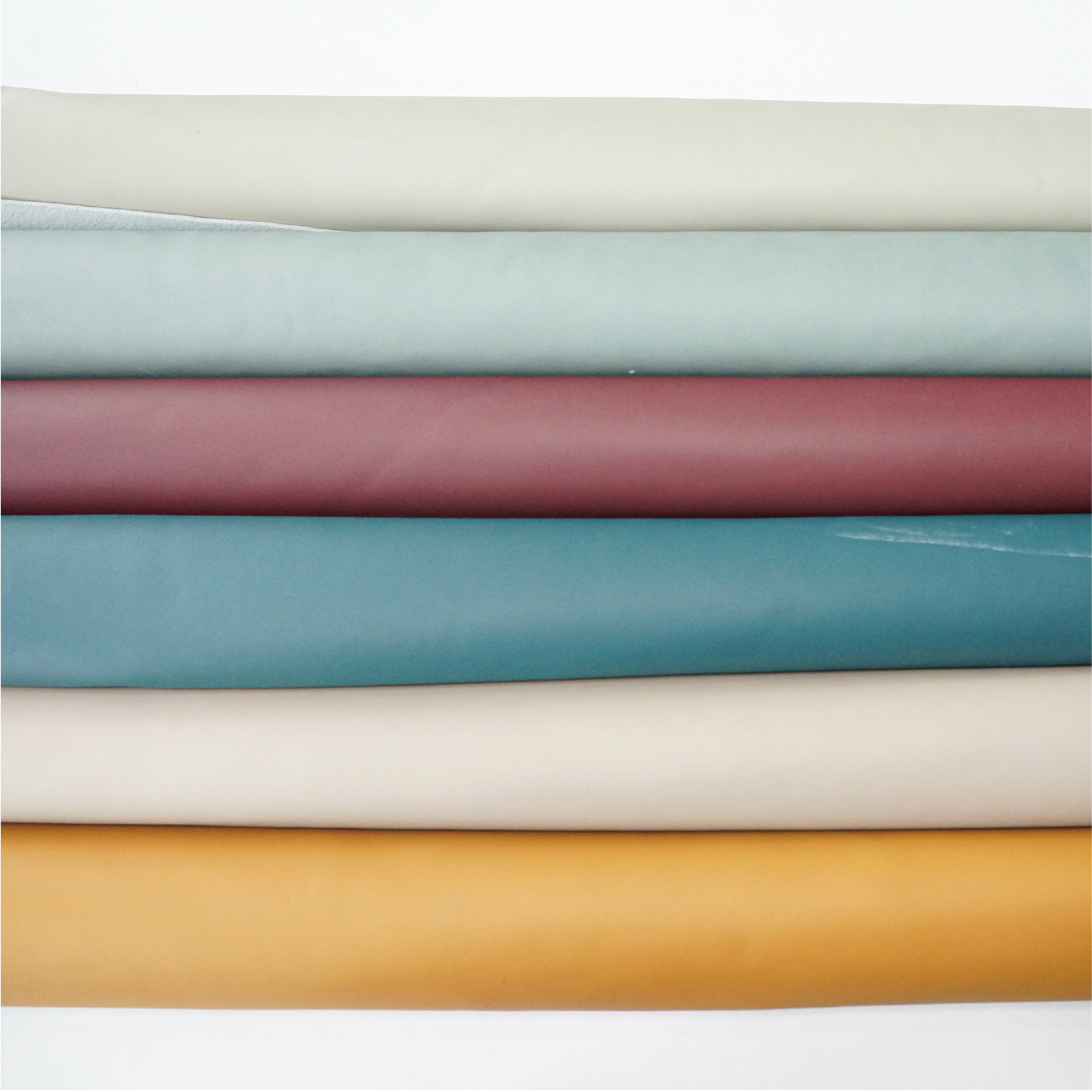 Synthetic leather upholstery material for sofas and chairs
