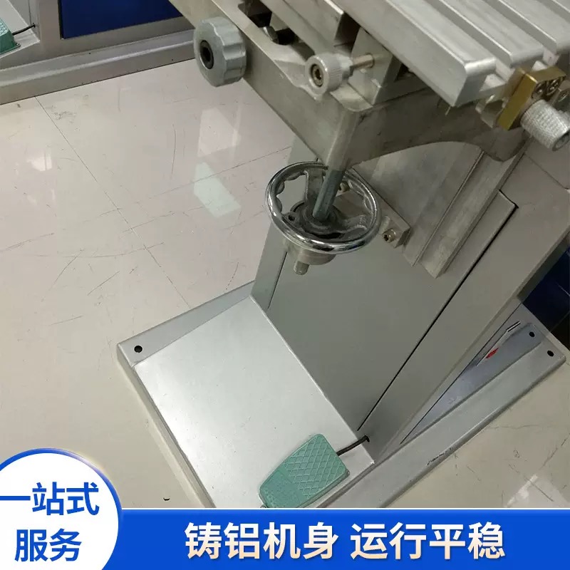 Detail view of the dual-color pad printing head and shuttle table