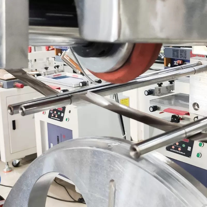 Detailed close-up of the servo-driven rotating fixture mechanism inside the stamping machine