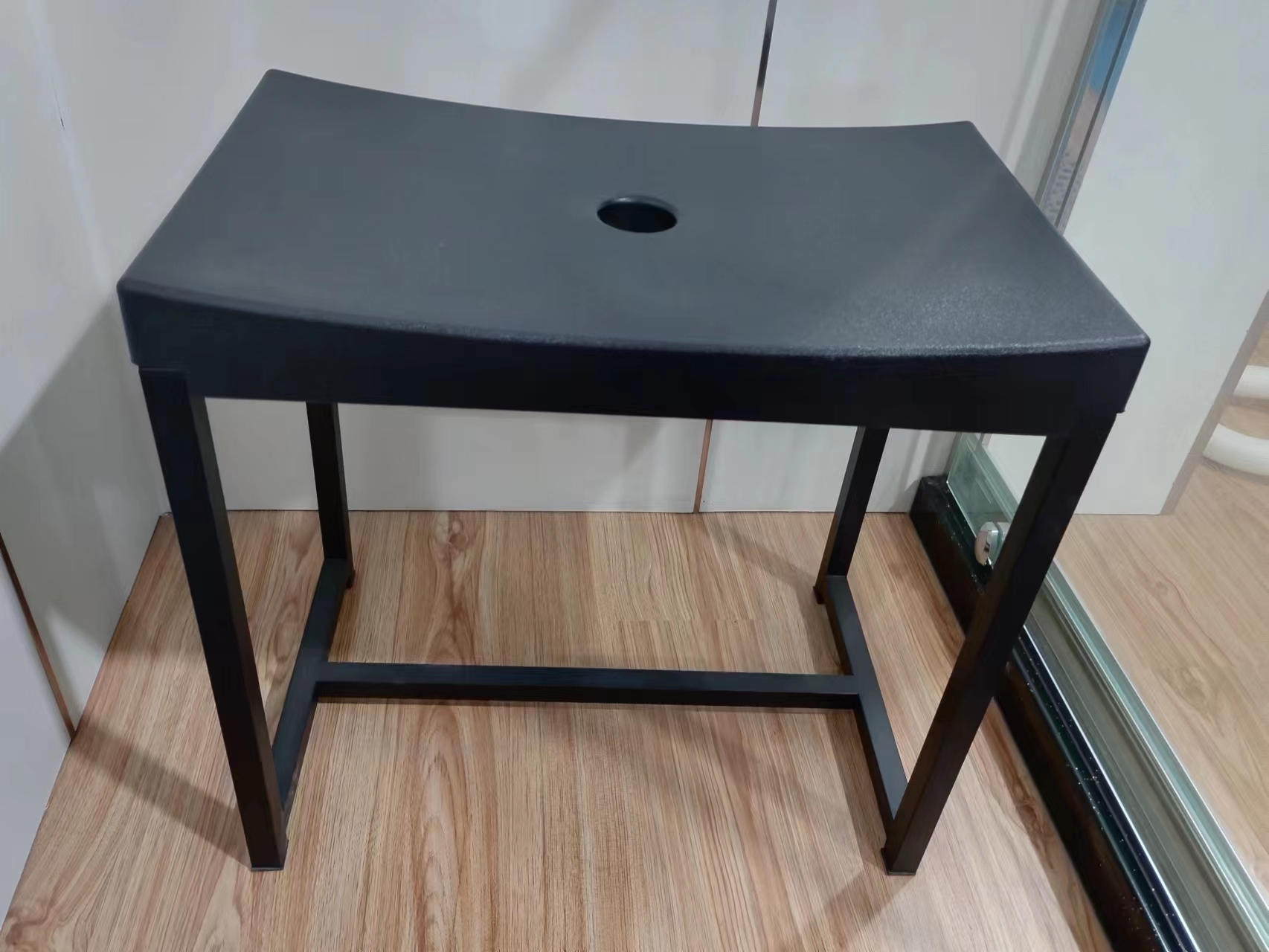 Mobile bathroom stool TX-116E featuring a matte black polyurethane seat and 304 stainless steel frame structure