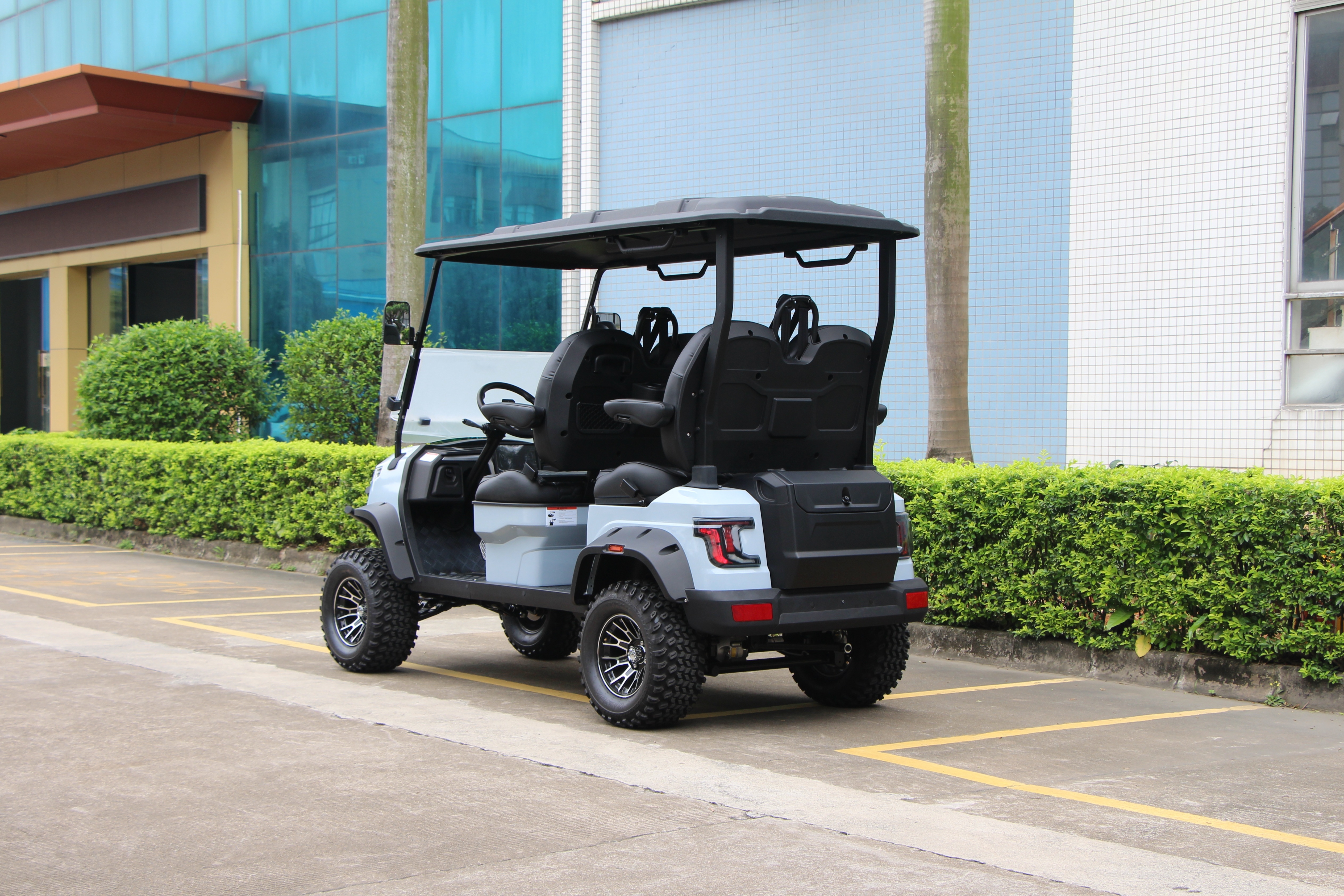 Electric golf cart featuring high-strength composite body panels and durable chassis construction