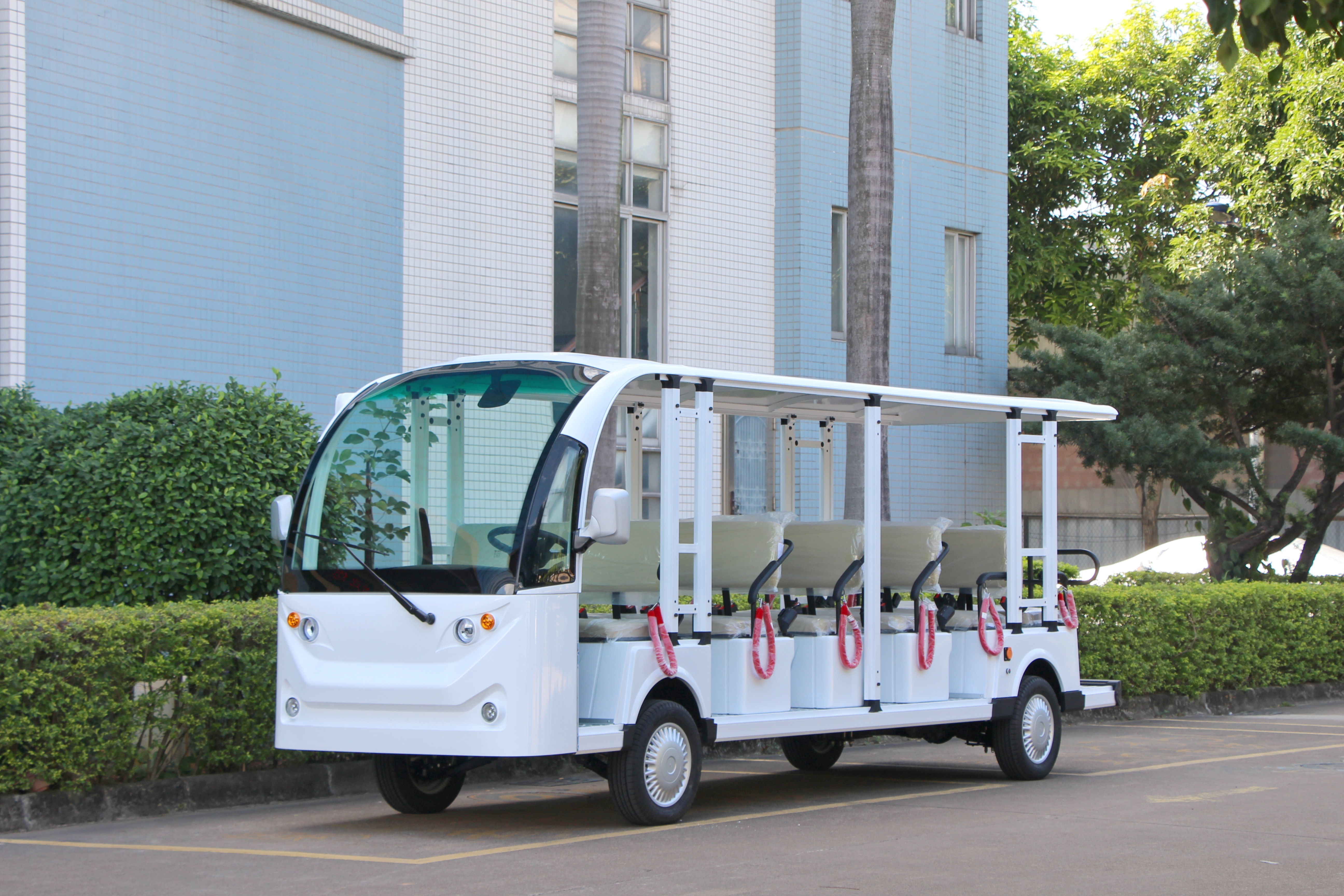 Detailed close-up of electric shuttle bus chassis and wheel assembly