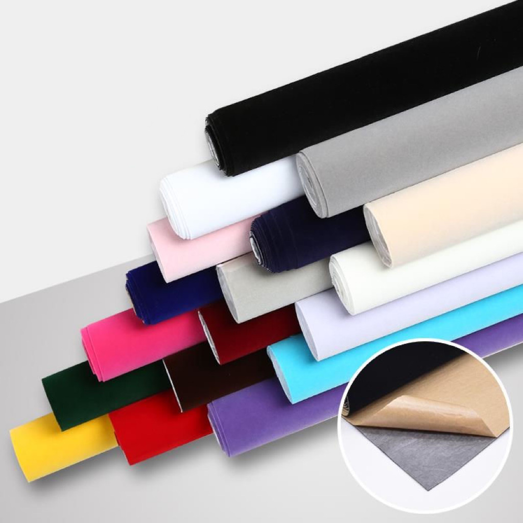Roll of premium long pile velvet fabric undergoing quality check