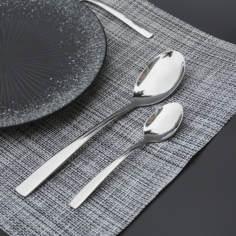 Mirror polished stainless steel cutlery with streamlined curved handles